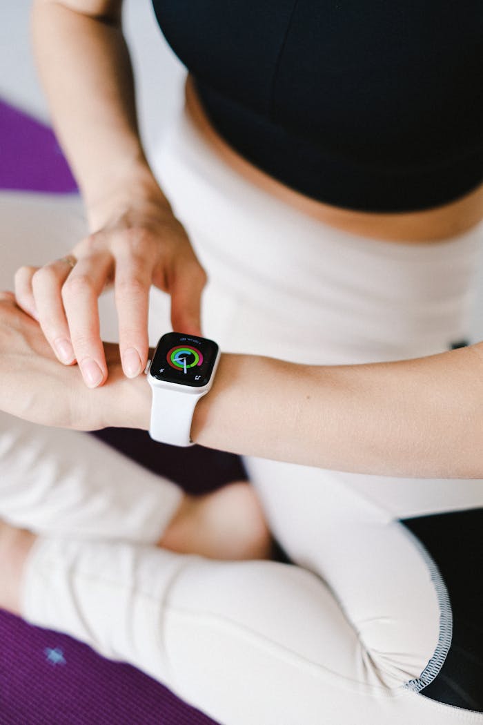 Close-up of a person using a smartwatch, highlighting technology in fitness activities.